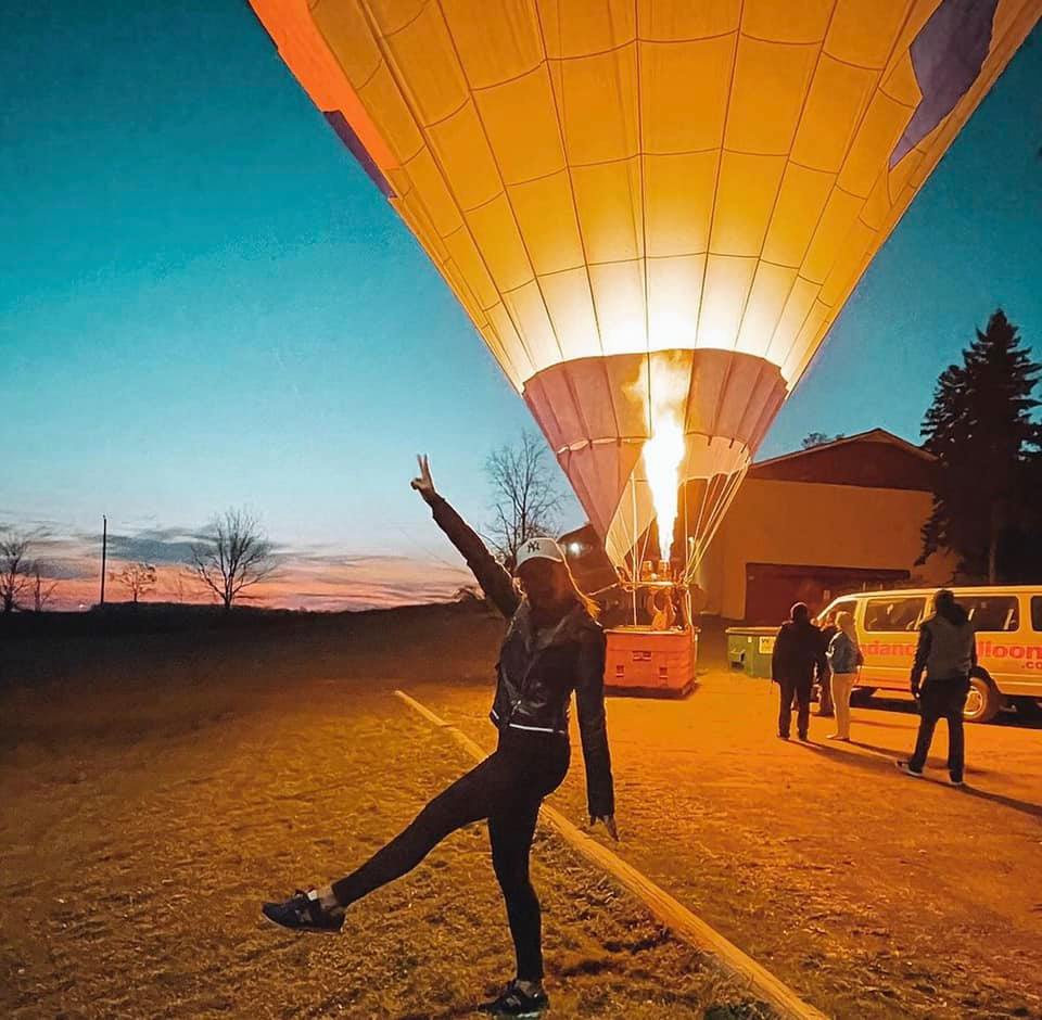Balloon crew preparing the basket in early morning light